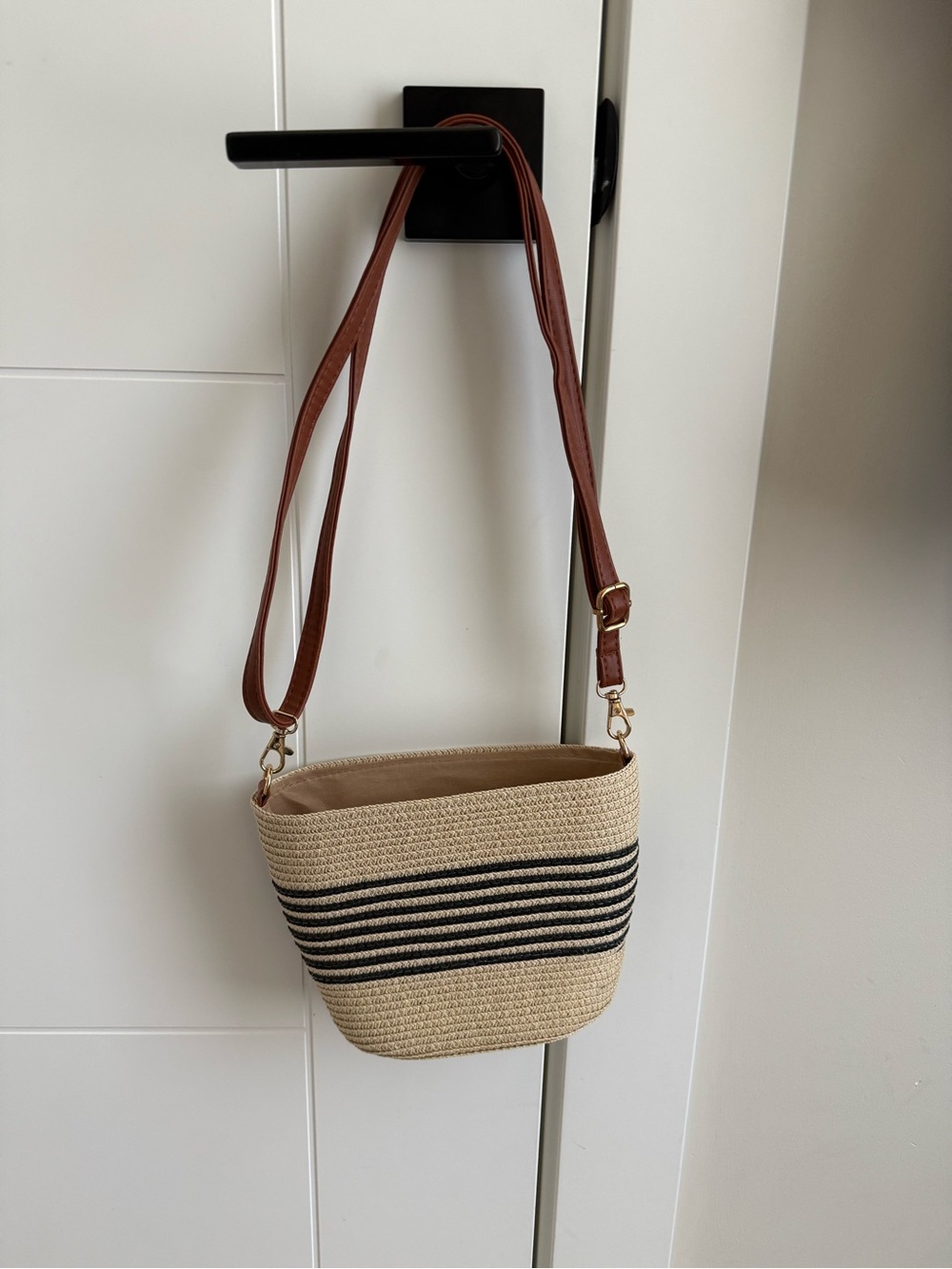 Woven Straw Crossbody Bag with Brown Strap and Black Stripe